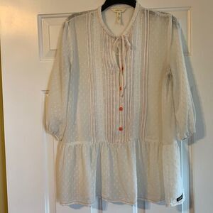 Matilda Jane Medium Peasant blouse. The color is cream with orange/peach detail